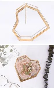Heart shaped glass jewelry box, brass edge retro storage container and home decor detail shot.