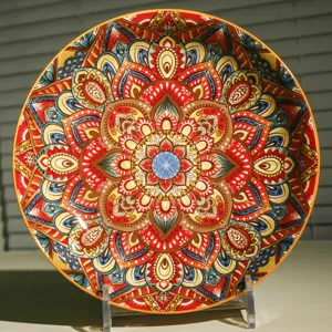 Detailed close-up of the ceramic plate featuring intricate bohemian mandala pattern art.