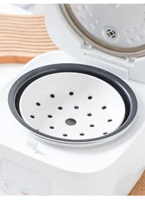 Ceramic steamer tray detail view, multi-hole food steamer dish for rice cooker kitchen use.