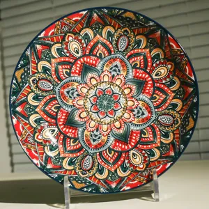 Exquisite 8-inch ceramic deep plate with vibrant mandala bohemian underglaze design close up.