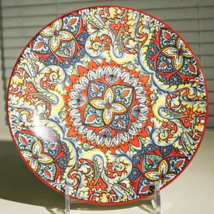 Exquisite 10 inch ceramic dinner plate with vibrant bohemian floral and bird pattern detail.