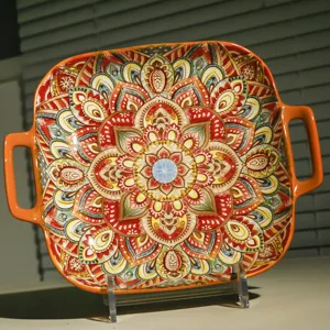 Square ceramic baking dish with dual handles and bohemian mandala pattern, detail view.