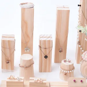 Solid wood jewelry display stand set with various necklaces and bracelets detail view