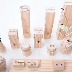 Detailed view of solid wood jewelry display stands set for necklaces earrings bracelets.