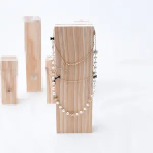 Detailed view of the solid wood jewelry display stand, showcasing natural wood grain and texture.