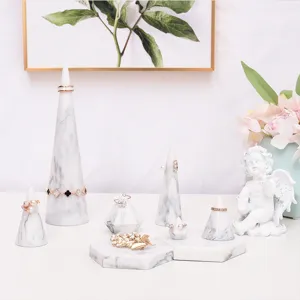 White marble resin ring holder cone jewelry display tray set for retail photography.