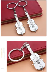 Detailed close-up of a creative silver metal violin instrument model keychain for music lovers