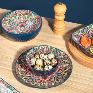 Detailed view of bohemian style ceramic bowls and plates featuring vibrant patterns.