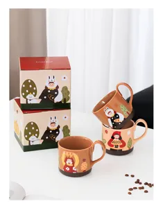 Creative ceramic coffee mug set with cute cartoon girl illustration and matching gift boxes.