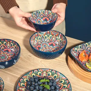 Bohemian ceramic bowl set detail view, featuring vibrant colorful floral patterns inside.