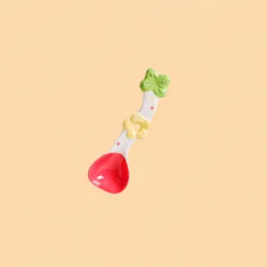 Detailed view of the cute ceramic spoon with dragon fruit design, measuring 16.3cm long.