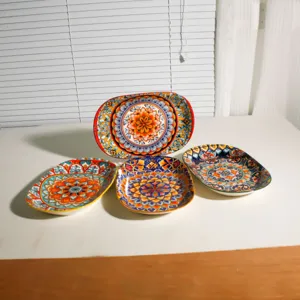Detail view of bohemian ceramic plate set featuring vibrant mandala patterns for kitchen tableware.