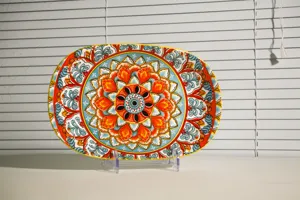 Decorative ceramic oval serving platter featuring vibrant bohemian mandala floral pattern for kitchen.