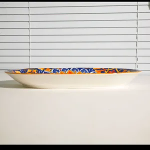 Ceramic bohemian style oval plate with blue and orange retro pattern rim for kitchen dining