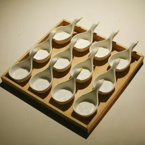 Ceramic bird snack dish set with wood tray, detailed view of cute ceramic tableware for tea.