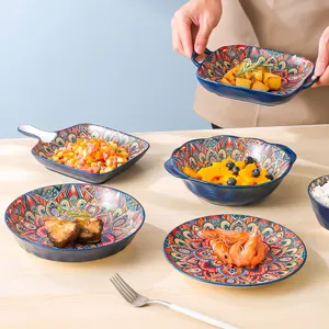 Blue bohemian ceramic tableware detail showing intricate mandala patterns and assorted dish shapes.