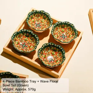 Detailed shot of four colorful ceramic bowls set neatly in a natural bamboo serving tray.