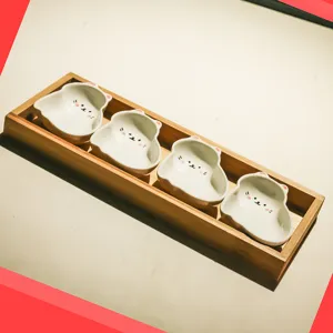 Cute cat ceramic snack dish set with wooden tray, ideal for serving dried fruits and desserts.