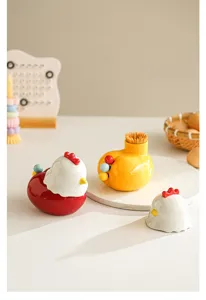 Cute ceramic chicken toothpick holder detail, lovely kitchen storage jar and fork container setup.