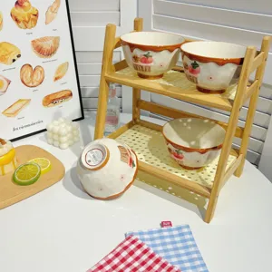 Ceramic strawberry cartoon bowl detail scene with wooden rack and cozy tabletop decor.