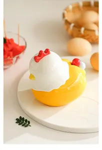 Cute ceramic chicken container detail, warm tabletop scene with eggs and basket setup.