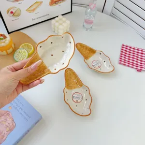 Ceramic ice cream cone shaped dessert plate hand painted cute cartoon salad bowl tabletop detail view.
