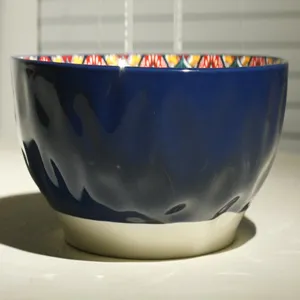 10-inch ceramic soup bowl with textured deep blue exterior and vibrant bohemian interior pattern.