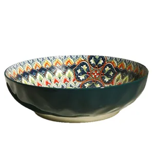 Large 10-inch bohemian ceramic soup bowl with colorful underglaze geometric pattern interior.