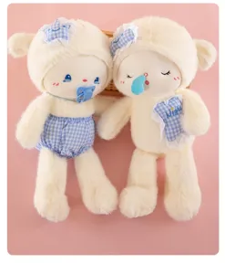 Cute plush sheep doll detail with blue plaid hat, pacifier and soothing pillow design.