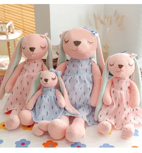 Detailed view of cute lop-eared plush rabbit dolls in dresses, perfect for children's gifts.