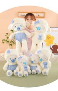 Detailed close up shot of cute plush sheep doll with blue plaid pacifier, ideal soft toy.