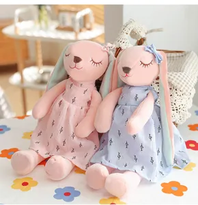 Cute lop-eared plush bunny toy pair in pink and blue dresses for kids sleeping pillow gift.