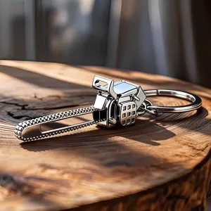 Creative metal chainsaw shaped keychain pendant with realistic detailing on wood background