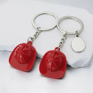 Creative red firefighter helmet keychain set with customizable round blank metal tag