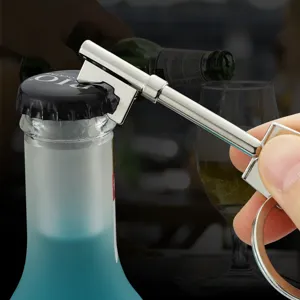 Creative silver metal key shaped beer bottle opener keychain used on a soda bottle