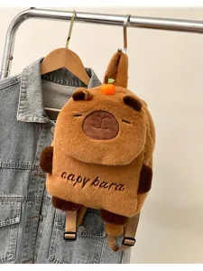 Cute capybara plush backpack for kids and students, soft stuffed animal shoulder bag with orange.