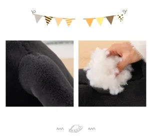 Black cat plush toy detail showing soft fuzzy fabric and fluffy stuffing inside stuffing view.