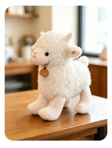 Detailed view of cute white plush lamb toy with soft curly wool and small wooden tag.