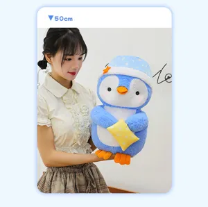 Detailed view of the cute sleeping cap penguin plush toy with pillow, soft plush texture.