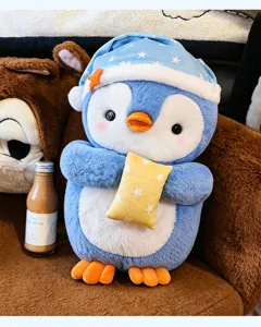 Cute sleeping hat penguin plush toy holding a yellow star pillow, soft and adorable stuffed doll.