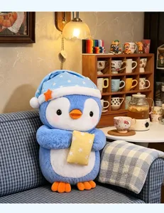 Cute blue penguin plush toy in cozy room setting, soft sleeping cap detail, cozy decor.