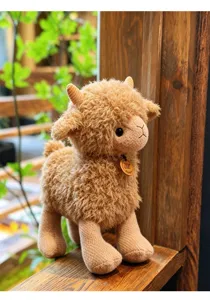 Cute fluffy ram plush toy, soft stuffed animal doll with knitted legs and horns for kids.