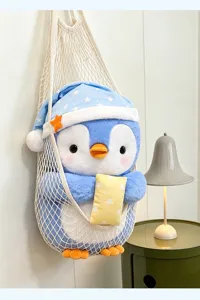 Cute sleeping penguin plush toy with nightcap and star pillow, soft stuffed animal gift.