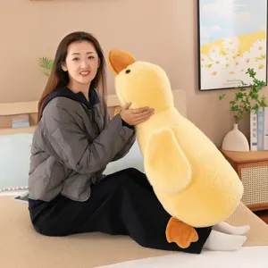 Cute yellow duck plush toy, soft sleeping pillow and cuddly doll gift for kids and girls.