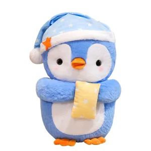Cute blue penguin plush toy wearing sleeping cap and holding small pillow for kids gift main