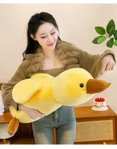 Detailed view of the soft yellow duck plush toy, perfect for hugging and bedroom decor.