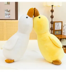 Cute duck plush pillow toy for kids, soft stuffed animal doll for sleeping companion birthday gift.