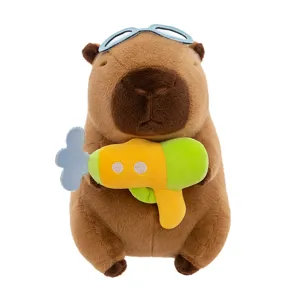 Cute capybara plush toy with diving goggles and water gun, soft doll gift for kids.
