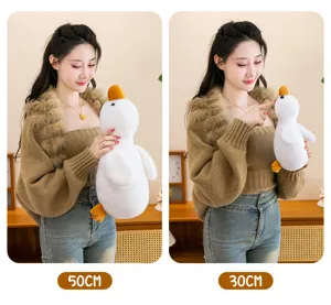 Close-up detail of soft white duck plush toy in 50cm and 30cm sizes for cozy decor.