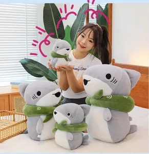 Detailed view of cute shark plush toy with green scarf, soft pillow for kids and girls.